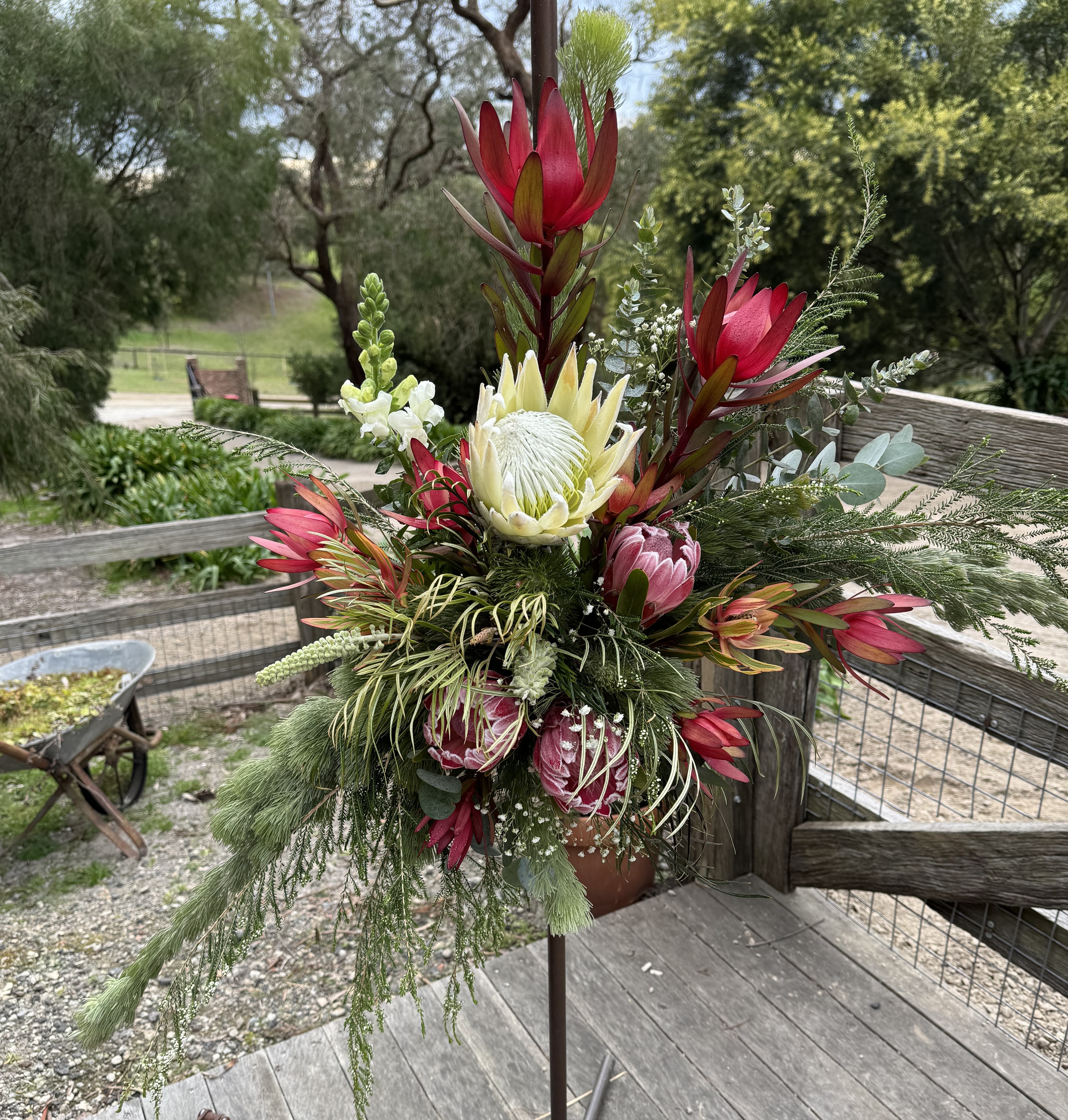 Flower arrangement on a black stand